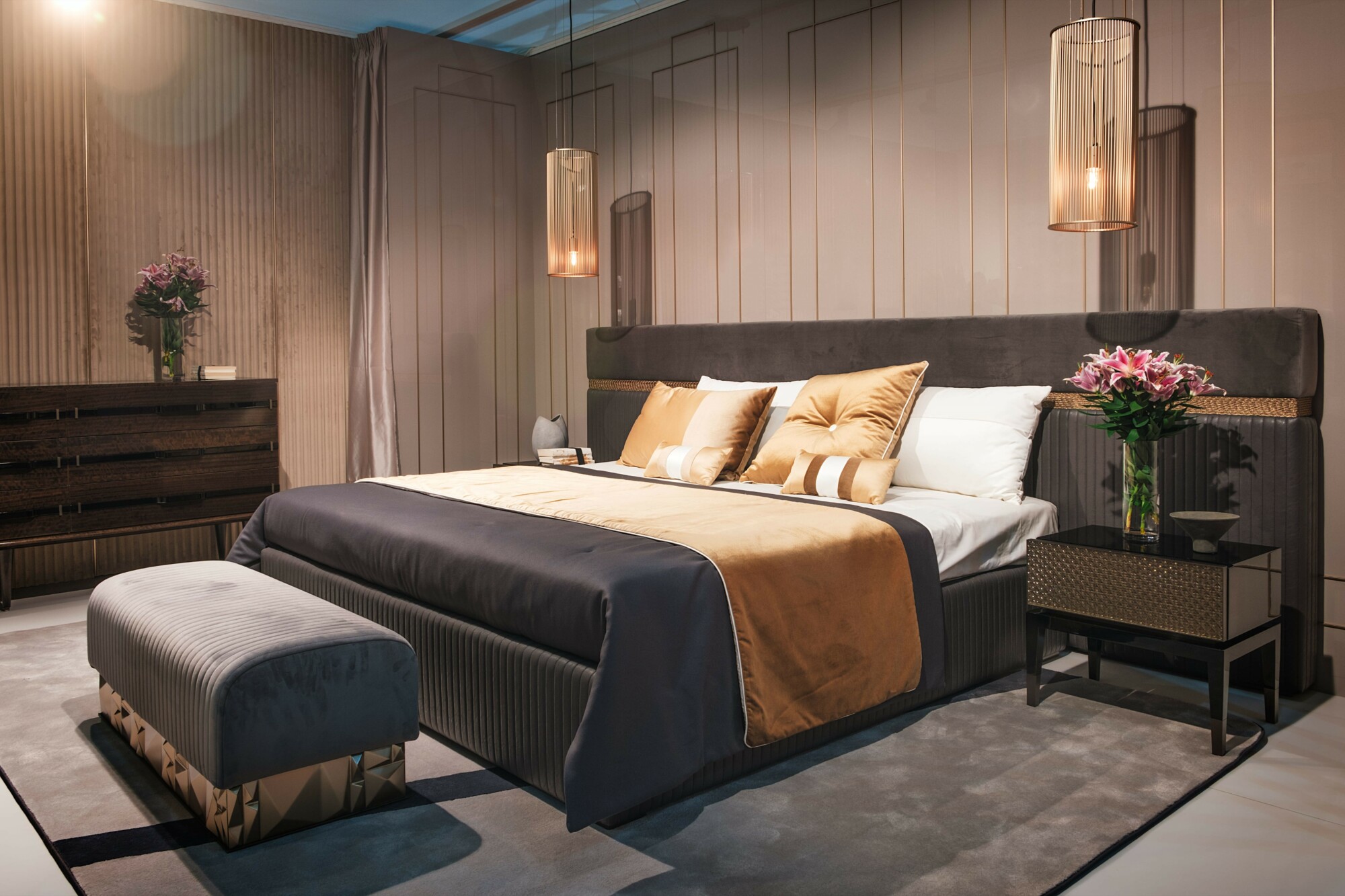 boutique hotel bedroom with large bed in the centre and bedside tables